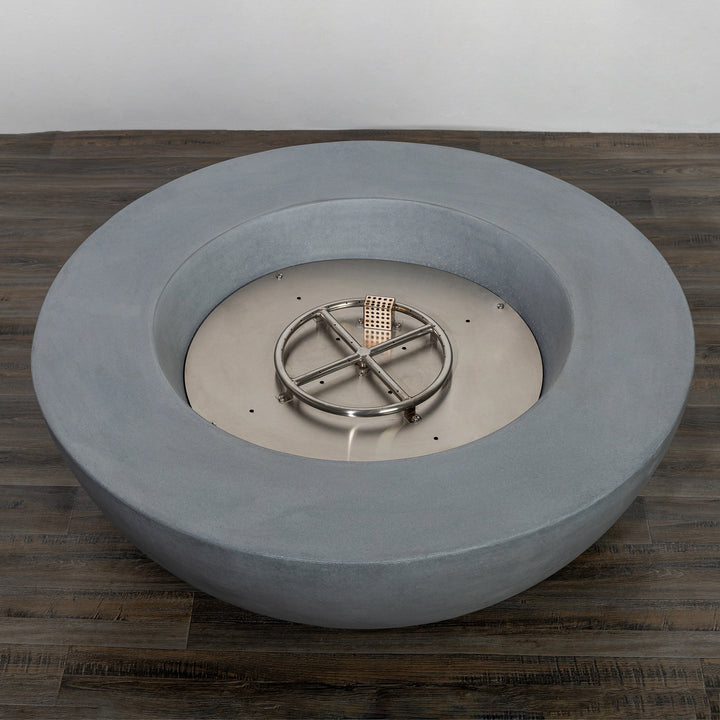 Top-down view of the Starfire Designs Beton 42 Inch Natural Gray Round Concrete Natural Gas Fire Pit with Push Button Ignition, highlighting the stainless steel burner and spacious concrete bowl design, ideal for modern outdoor spaces