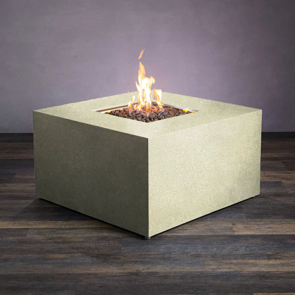 The Starfire Designs Beton 42-inch square hidden propane tank fire pit in sand color, displaying a vibrant flame, perfect for adding warmth and ambiance to any outdoor setting