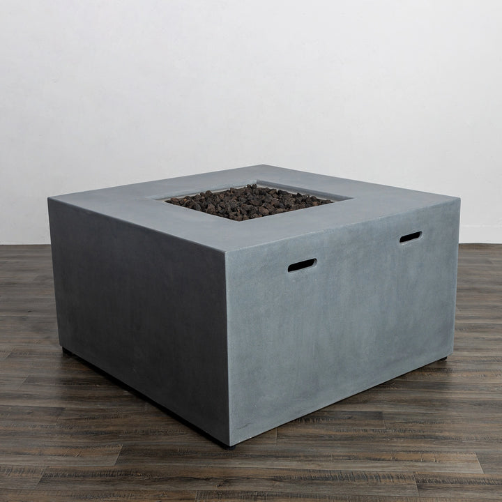 Angled view of the Starfire Designs Beton 42" Natural Gray Square Hidden Propane Tank Gas Fire Pit, emphasizing its sleek hidden propane tank feature and premium concrete craftsmanship. The design blends seamlessly into any modern outdoor patio or backyard.