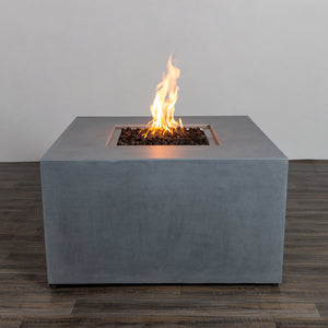 Front view of the Starfire Designs Beton 42" Natural Gray Square Hidden Propane Tank Gas Fire Pit, featuring a clean and modern square design with a durable concrete finish. The natural gray color complements outdoor spaces, showcasing its lava rocks and elegant flames. Ideal for patios and backyard gatherings.