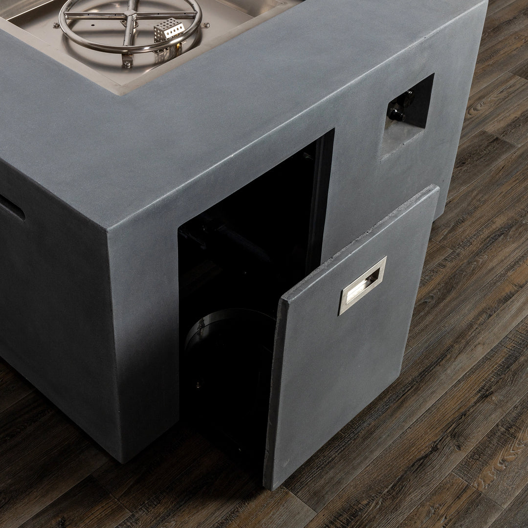 The hidden propane tank door of the Starfire Designs Beton 42" Natural Gray Square Fire Pit, showing convenient access for tank replacement and storage. Modern square design and natural gray finish add style and functionality.