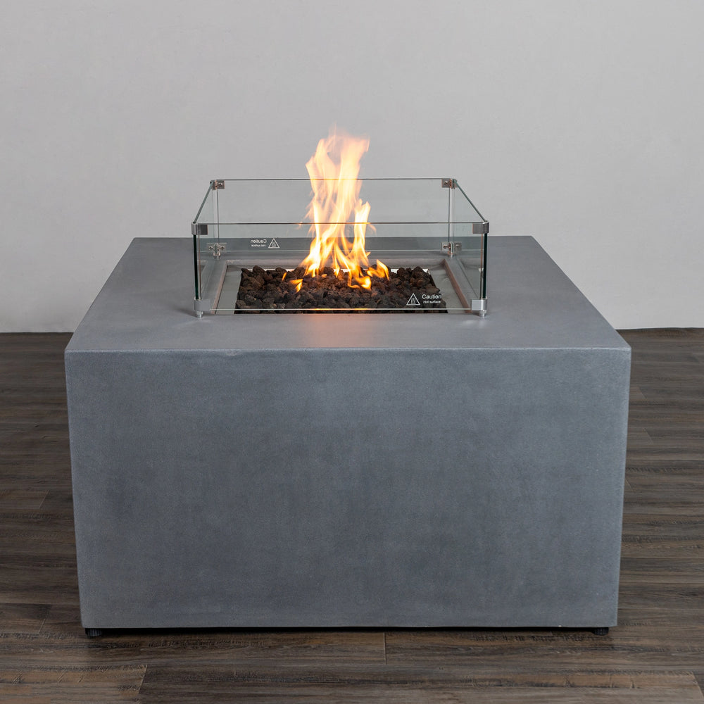 Starfire Designs Beton 42" Natural Gray Square Hidden Propane Tank Gas Fire Pit with a glass wind guard and lively flames, creating an inviting ambiance. A sophisticated centerpiece for outdoor patios and backyards.