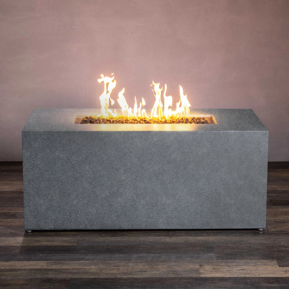 Front view of the Starfire Designs Beton 55" Graphite Rectangle Hidden Propane Tank Gas Fire Pit, highlighting the sleek and minimalist concrete construction in graphite finish. The rectangular burner emits bright, tall flames, creating a warm and inviting ambiance while concealing the propane tank for a clean look