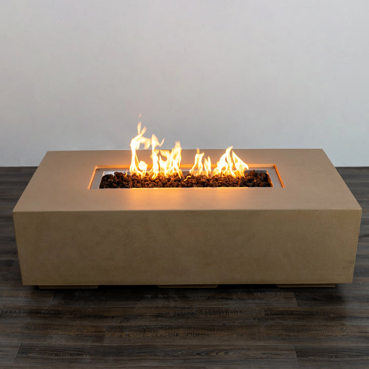 Elegant flame display on the Starfire Designs Beton 55-inch sand rectangle gas fire pit, showcasing a glowing fire that enhances the ambiance of outdoor patios. The sand-colored concrete finish adds a touch of modern sophistication to backyard settings