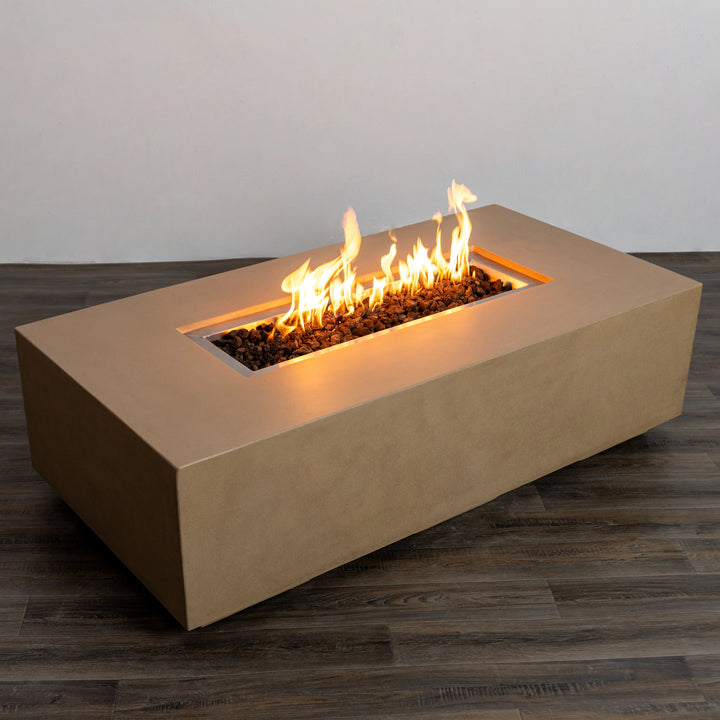 Starfire Designs Beton 55-inch sand-colored rectangular gas fire pit with roaring flames and no wind guard. The sleek concrete surface in sand tone contrasts beautifully with the glowing fire, making it an ideal centerpiece for outdoor relaxation