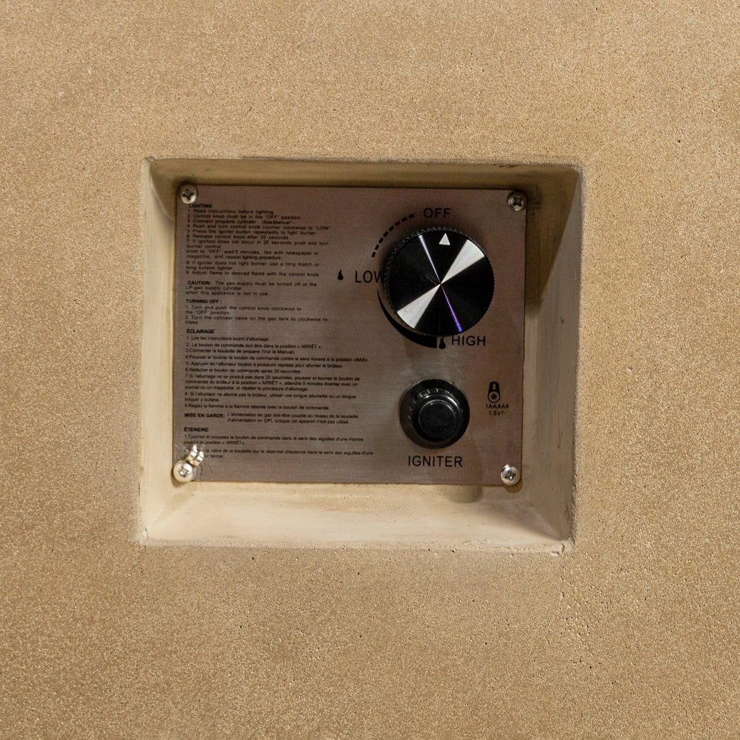  Close-up of the control panel on the Starfire Designs Beton 55" Sand Rectangle Hidden Propane Tank Gas Fire Pit, showing the stainless steel igniter button and flame control dial for adjusting the fire intensity.