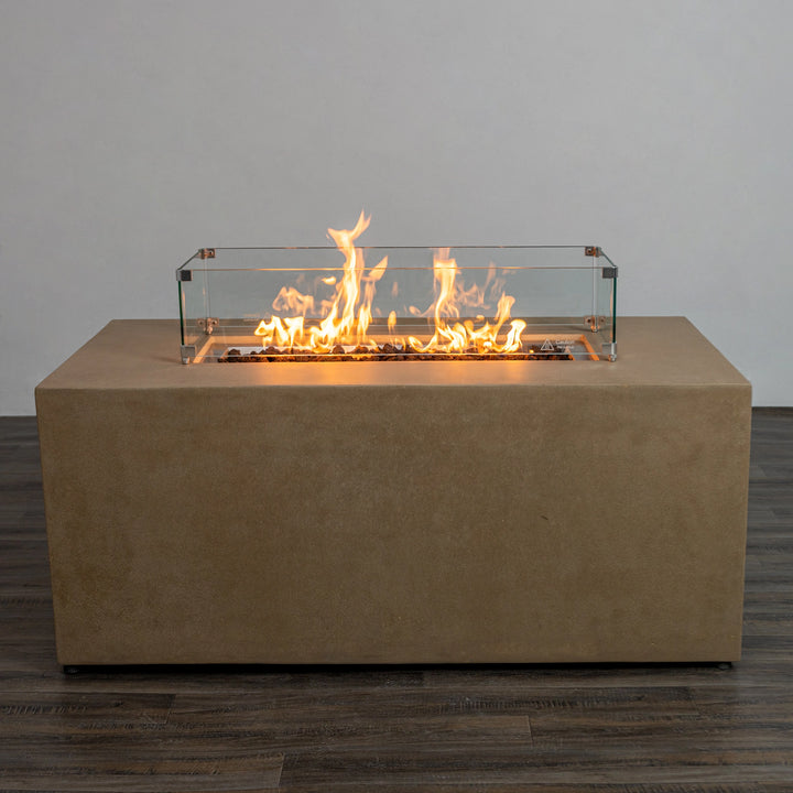 Starfire Designs Beton 55" Sand Rectangle Hidden Propane Tank Gas Fire Pit lit with flames, displaying realistic fire ambiance and lava rock media within the rectangular burner pan. A perfect addition for patio gatherings and outdoor living spaces.