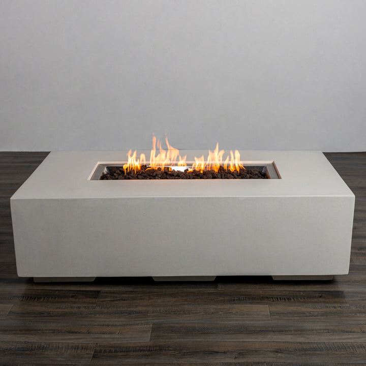 Front view of the Starfire Designs Beton 55" White Rectangle Gas Fire Pit with bright, flickering flames. The sleek, minimalist concrete design in white pairs beautifully with any modern patio or backyard decor. 