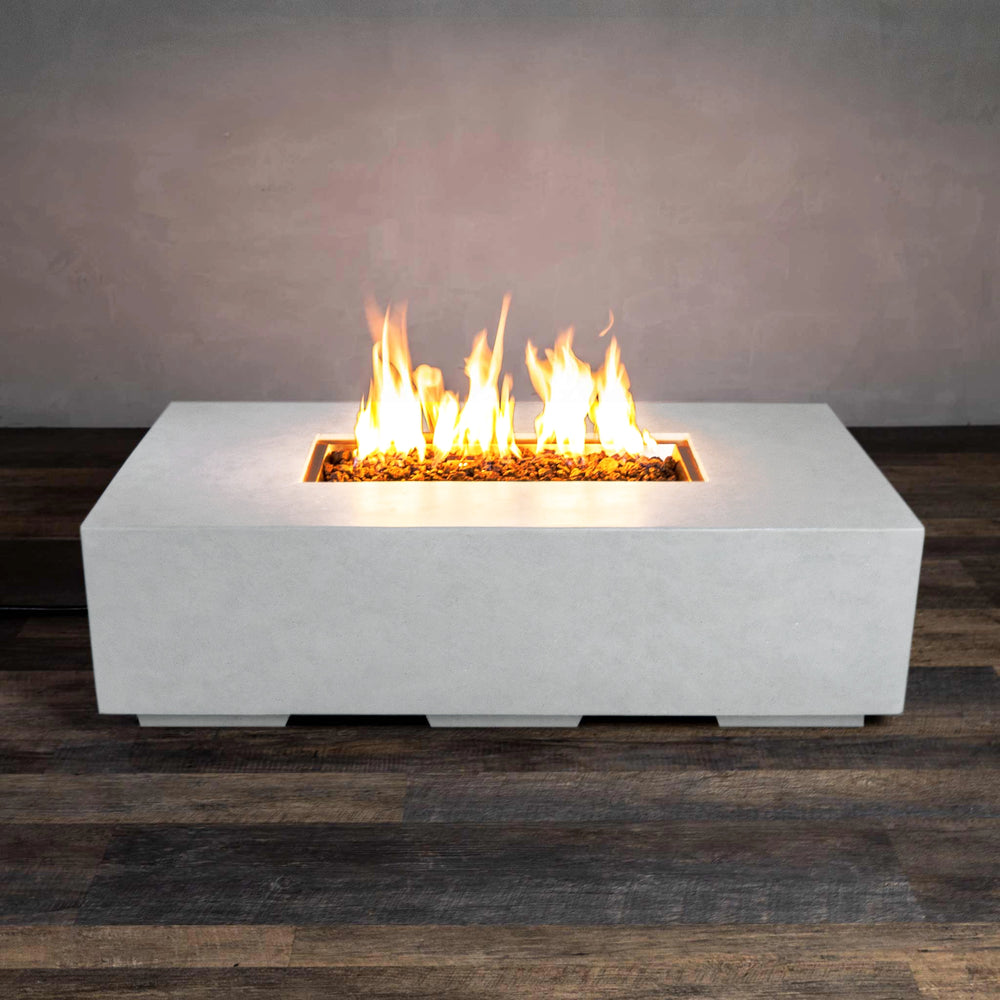 The side view of the Starfire Designs Beton 55" White Rectangle Gas Fire Pit showcases its minimalist rectangular structure. The white concrete body is durable and modern, providing a refined look to any backyard or patio. Equipped with a powerful burner, it ensures high-performance heat output. 