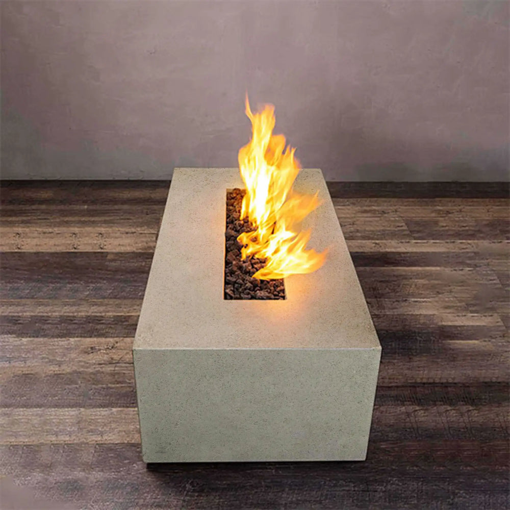 Beige concrete rustic 60"x24" linear gravity gas fire pit with flames, ideal for luxury outdoor settings. Keywords: luxury fire pit, outdoor fire bowl, natural gas fire pit, large gas fire pit, modern fire pit