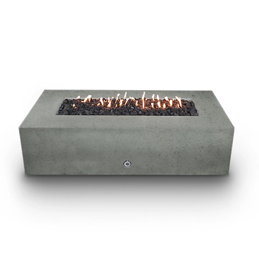 Starfire Designs Concrete Rustic Gravity Gas Fire Pit in natural gray, 60" x 32", with flames burning along the stainless steel burner. The long rectangular shape and smooth concrete finish bring a modern yet rustic feel to any outdoor area. The dancing flames provide a warm and inviting atmosphere. Best for residential and commercial outdoor use