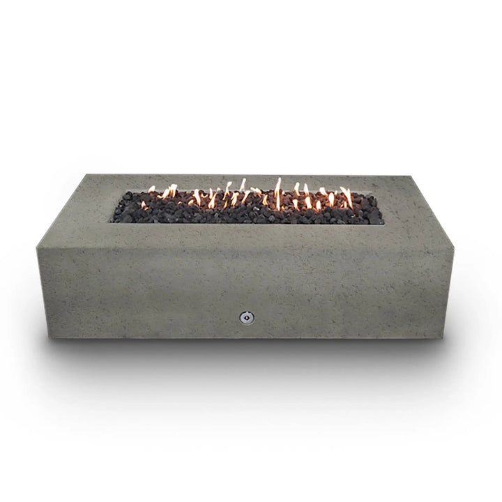 Front view of the Starfire Designs Concrete Rustic 72" x 38" Rectangle Gravity Gas Fire Pit in Beige, filled with black lava rocks and lit with flames. The combination of rugged lava rocks and smooth concrete offers a striking contrast, making it an ideal choice for both modern and traditional outdoor settings