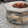 Lifestyle image of the Starfire Designs Mosaic Decorative Fire Pit Venting Panel installed in a stone outdoor fire pit, showing the seamless integration of the vent panel with a modern fire pit design, enhancing both aesthetics and functionality