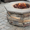 Installed view of Starfire Designs Decorative Fire Pit Venting Panel - Trellis in a stone fire pit setting, demonstrating its integration into outdoor fire features, adding both safety and a contemporary design element to backyard fire pits