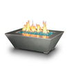 Starfire Designs Edge Stainless Steel Gas Fire Pit in a 48x32 inch rectangular shape, presented on a white background, with sharp angles and a minimalist design. This premium fire pit features vibrant blue fire glass, providing a beautiful contrast to the polished stainless steel, enhancing outdoor living areas with a touch of sophistication