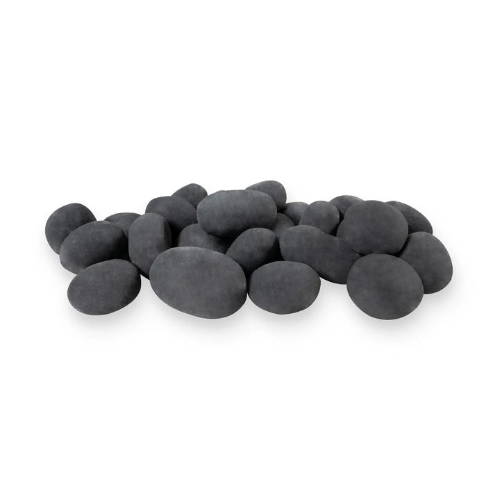 A set of 24 dark gray Starfire Designs Fire Pebbles stacked in a product silo image. These ceramic fire pebbles provide a sleek, natural look while offering superior durability and heat resistance. A perfect choice for a modern, upscale fire pit design.