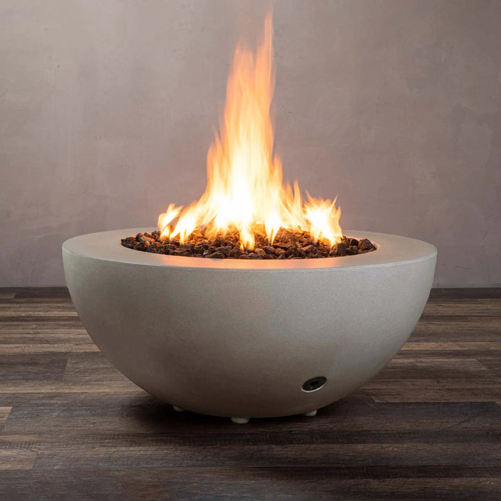 Starfire Designs Gravity 36-inch round concrete gas fire pit in beige, full view with bright flame, perfect for outdoor use, designed with durable construction and smooth finish for a modern aesthetic