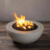 Side view of the Starfire Designs Gravity 36-inch round concrete gas fire pit in beige, showcasing a clean design with a lively flame, ideal for luxury outdoor spaces, weather-resistant, and built for longevity