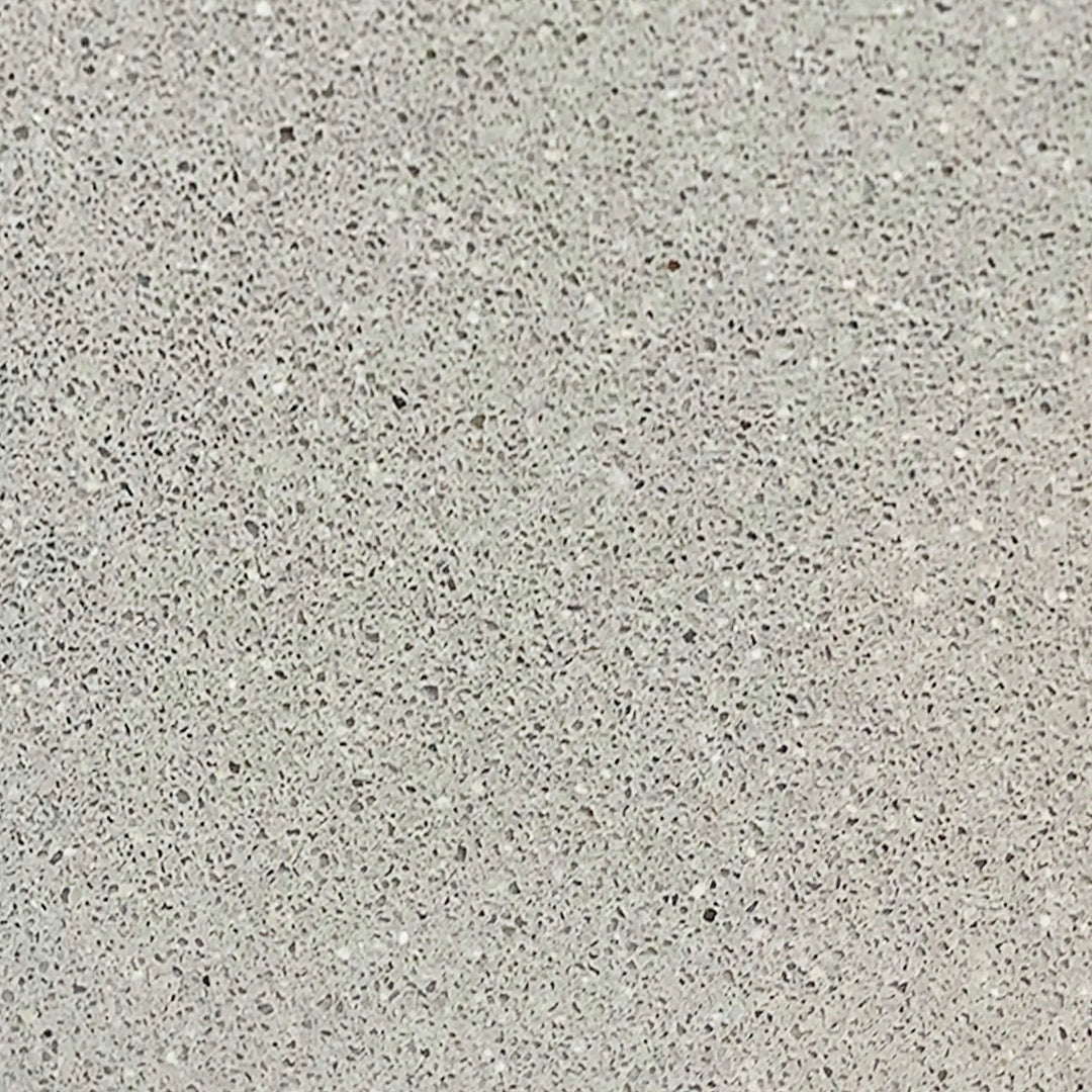 Natural gray texture swatch for Starfire Designs Gravity 36-inch round concrete gas fire pit, illustrating the versatile and neutral tone of the concrete. The natural gray color pairs well with any outdoor decor, providing a timeless, durable surface for fire pits. Natural gray fire pit, outdoor concrete finish, timeless design