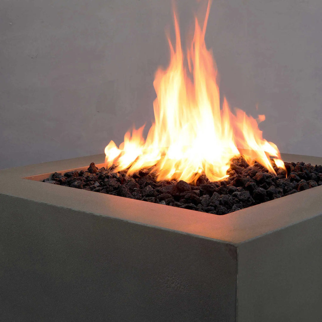 "Close-up view of the flames on the Starfire Designs Gravity 36-inch brown square concrete gas fire pit. Showcasing the stunning flame height and high-end design of this outdoor gas fire feature. The brown finish complements any outdoor decor, while the sleek concrete structure ensures longevity."