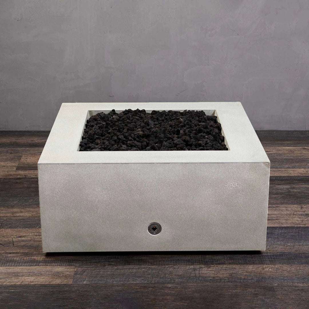 Top-down view of the Starfire Designs Gravity 36" Square Concrete Gas Fire Pit showcasing the clean, smooth white concrete and lava rock fill. Ideal for outdoor patios and landscape designs. 