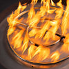 Close-up of the burner flame inside the Starfire Designs Gravity 45-inch round gas fire pit in brown. This detailed view highlights the stainless steel burner ring, ensuring a consistent and even flame distribution. Ideal for outdoor spaces seeking both style and functionality