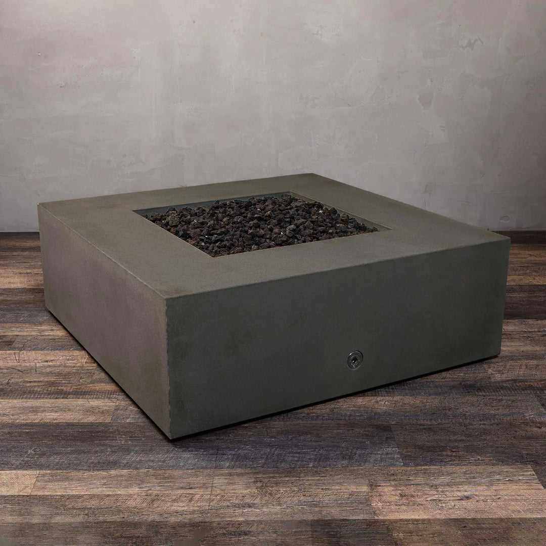 Front view of the Starfire Designs Gravity 45-inch Square Concrete Gas Fire Pit in brown with a focus on its lava rocks and burner area. This fire pit is designed for high performance and aesthetic appeal, making it a luxurious centerpiece for any patio or outdoor living space.