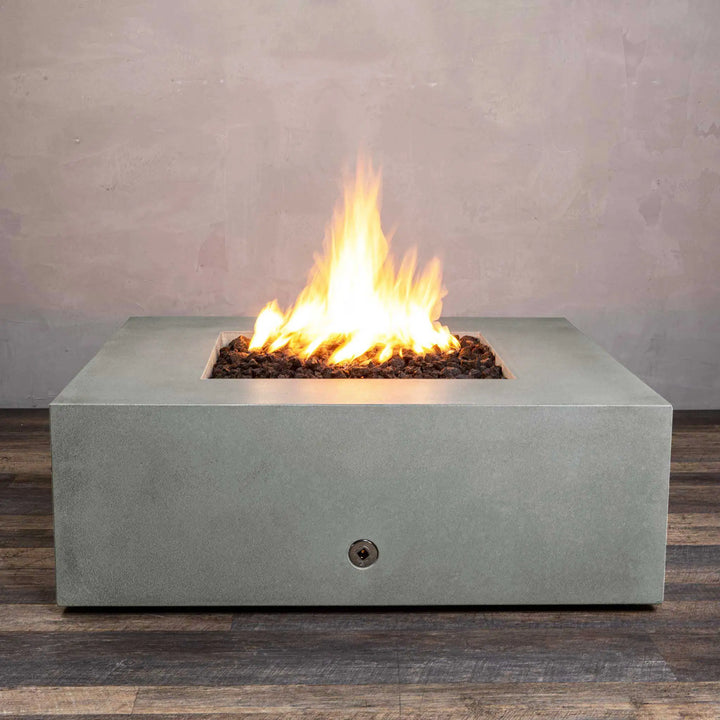 Front view of the Starfire Designs Gravity 45-inch Square Concrete Gas Fire Pit in natural gray, showcasing its modern, square shape with vibrant flame and lava rocks. Durable concrete design suitable for outdoor use, offering an elegant centerpiece for outdoor spaces