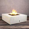 Side view of the Starfire Designs Gravity 45-inch Square Concrete Gas Fire Pit in white, featuring vibrant flames surrounded by lava rocks. This sleek, minimalist design enhances any outdoor living area, offering a balance of style and functionality with gas operation