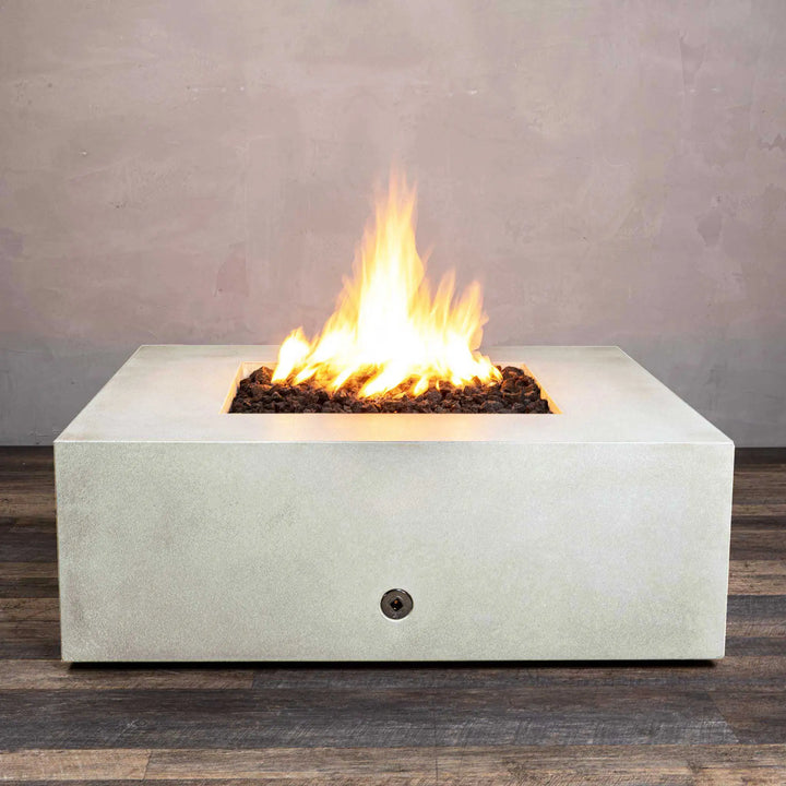 Starfire Designs Gravity 45-inch Square Concrete Gas Fire Pit in white, showcasing a large flame with lava rocks inside the fire bowl, perfect for outdoor patios. Durable and modern in design, this fire pit is ideal for contemporary outdoor spaces. Gas-powered for easy use, providing warmth and ambiance