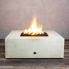 Starfire Designs Gravity 45-inch Square Concrete Gas Fire Pit in white, showcasing a large flame with lava rocks inside the fire bowl, perfect for outdoor patios. Durable and modern in design, this fire pit is ideal for contemporary outdoor spaces. Gas-powered for easy use, providing warmth and ambiance