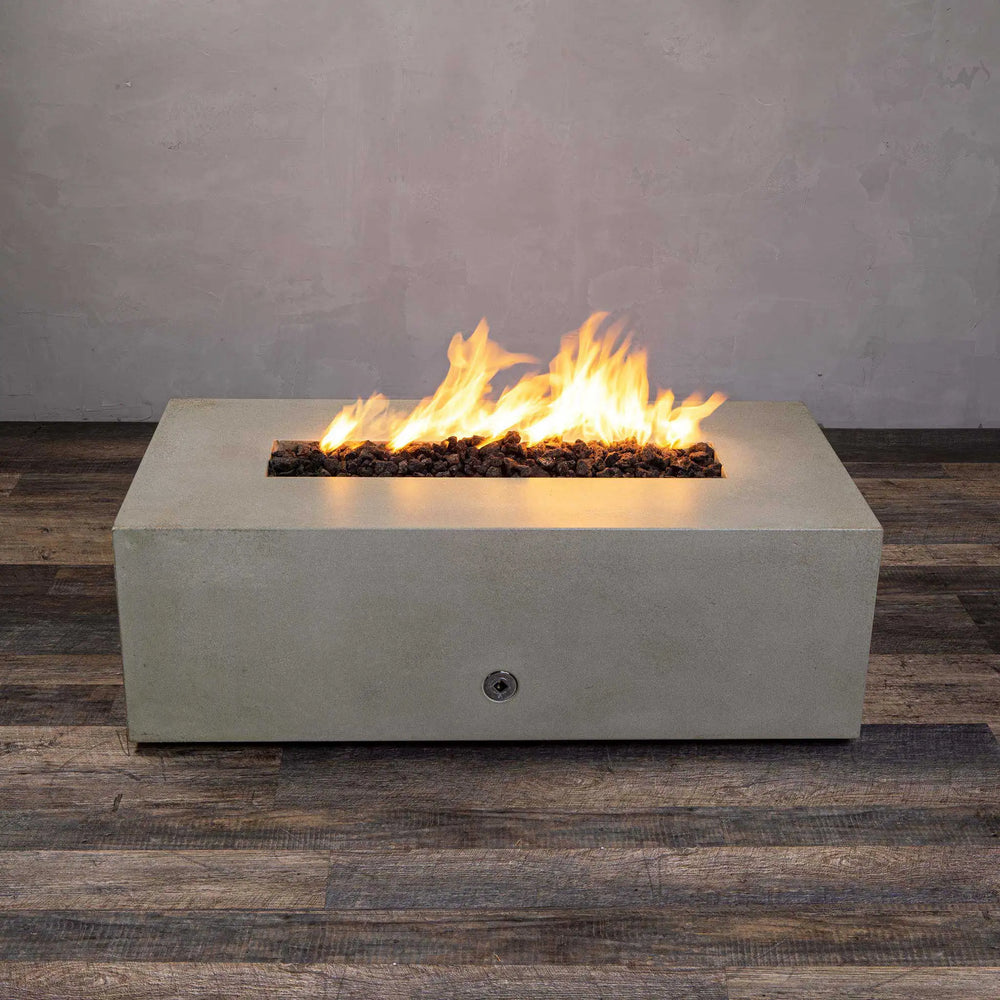 Top view of the Starfire Designs Gravity 48-inch x 32-inch rectangle beige concrete gas fire pit with bright flames and lava rocks. Ideal for outdoor living spaces, this fire pit offers a stylish modern design and durable construction for both residential and commercial use.