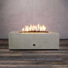 Front view of the Starfire Designs Gravity 60-inch by 24-inch Linear Concrete Gas Fire Pit in Beige, showcasing vibrant flames, ideal for modern outdoor spaces, providing warmth and style.