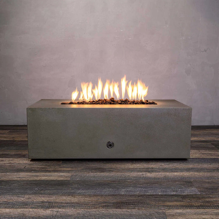 Front view of the Starfire Designs Gravity 60-inch by 24-inch Linear Concrete Gas Fire Pit in brown, featuring a sleek, rectangular design with vibrant flames atop a smooth brown concrete surface, ideal for enhancing outdoor living spaces