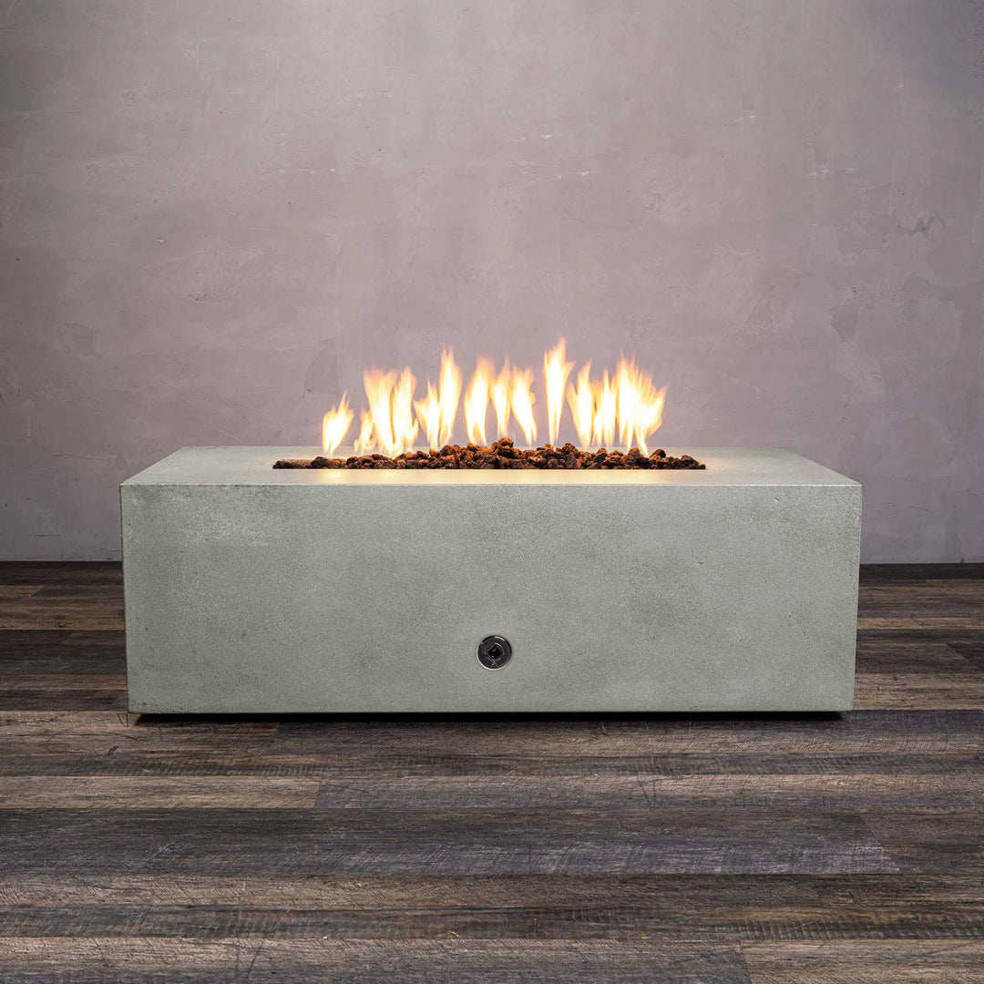 Front view of Starfire Designs Gravity 60-inch by 24-inch linear concrete gas fire pit in natural gray, showcasing its modern and minimalist design, perfect for outdoor spaces. Features a linear burner with natural lava rocks. Ideal for backyard fire pits, outdoor fire bowls, and modern outdoor fire pits