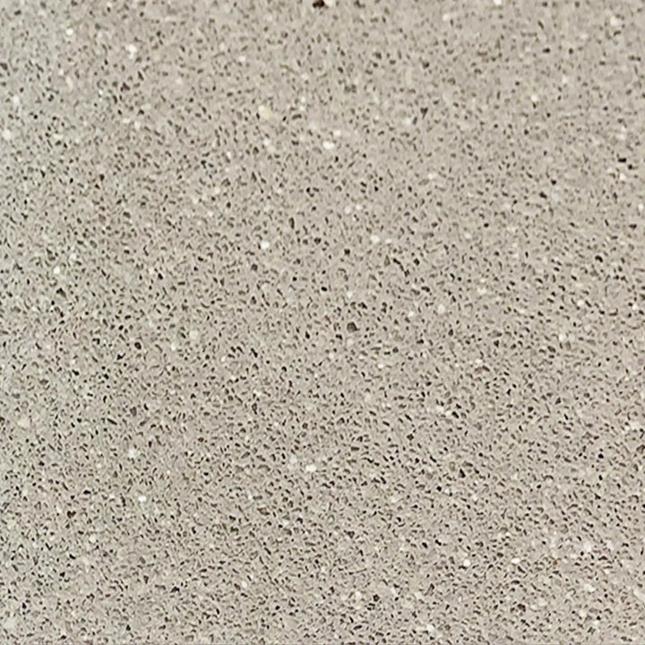 Close-up texture of the beige swatch for the Starfire Designs Gravity 60 x 24 inch Linear Concrete Gas Fire Pit. The surface showcases a fine, speckled pattern in light beige, providing a natural, earthy look. Perfect for blending seamlessly with outdoor environments while adding a touch of elegance to any patio setting. Durable concrete construction ensures longevity and resilience against weather elements