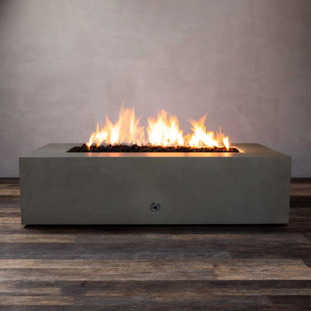 Front view of the Starfire Designs Gravity 60" x 32" Rectangle Concrete Gas Fire Pit in brown finish with visible bright flames, showcasing its smooth concrete texture and modern rectangular design. Ideal for outdoor spaces, offering both aesthetic appeal and functionality.