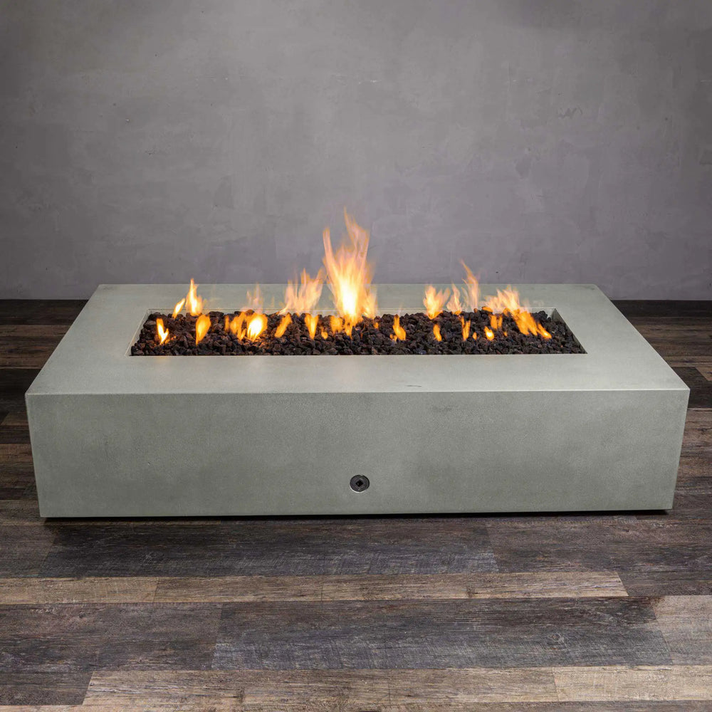 Top view of the Starfire Designs Gravity 72" x 38" rectangle concrete gas fire pit in natural gray, showcasing the lava rocks and bright flames. The sleek, minimalistic design blends perfectly into outdoor spaces, providing both functionality and aesthetic appeal. Suitable for luxury outdoor setups and modern garden designs.