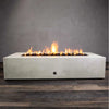 Front view of the Starfire Designs Gravity 72 x 38 inch rectangle concrete gas fire pit in white, showcasing a large flame in the center with lava rocks. The sleek modern design and sturdy concrete material make this fire pit a durable and stylish addition to any outdoor space. Perfect for residential or commercial settings. Outdoor gas fire pit, modern concrete design, durable, and luxury outdoor heating