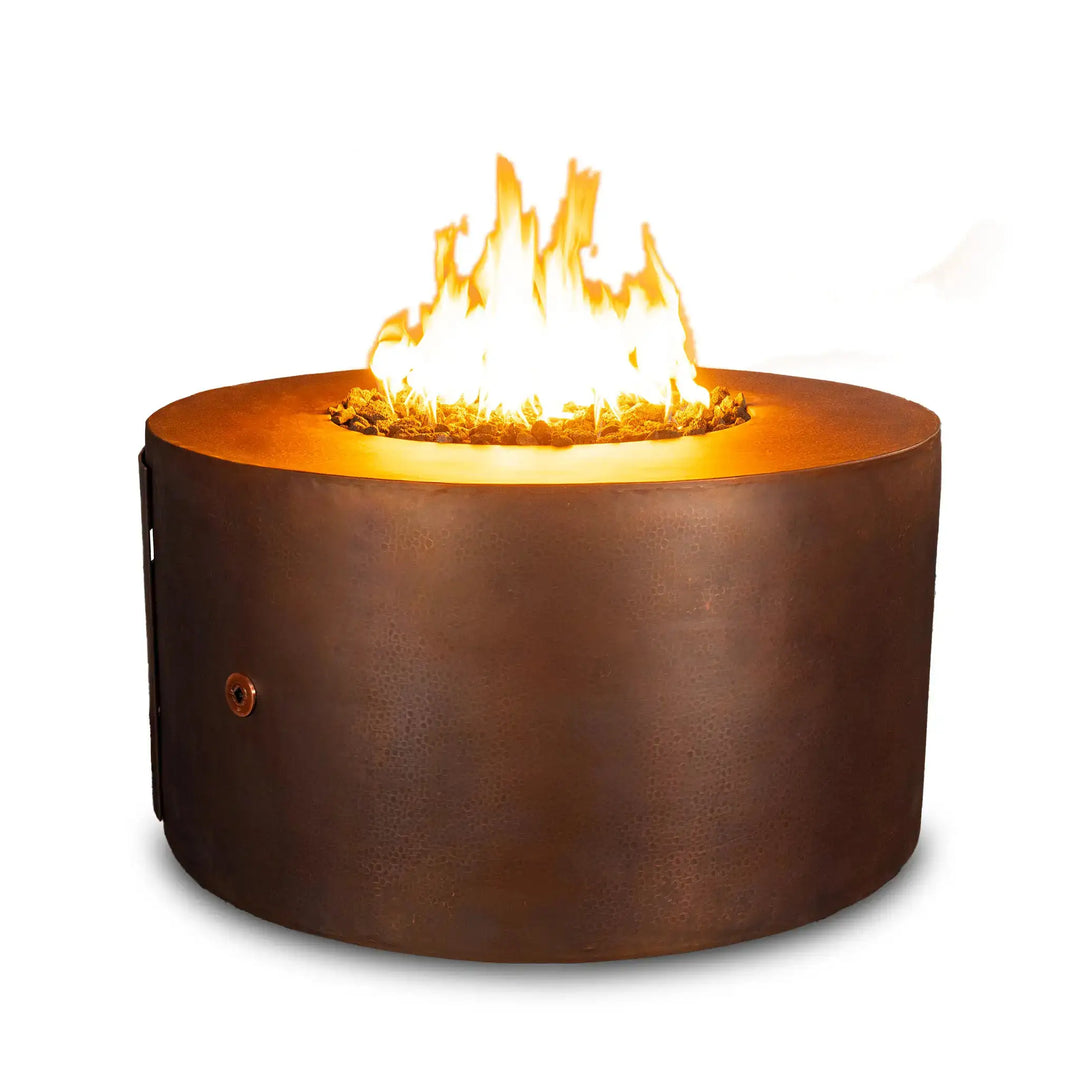 Front view of the Gravity Moreno 45-inch round LPT copper fire pit by Starfire Designs, showcasing its elegant design with a vibrant flame and hammered copper finish, ideal for enhancing any patio or outdoor setting