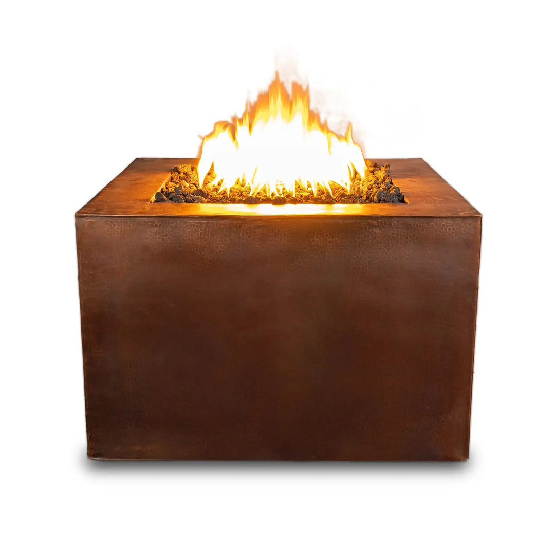 Front view of the 36-inch Gravity Moreno square copper fire pit by Starfire Designs, featuring a hammered copper finish and bright flames, isolated against a white background.