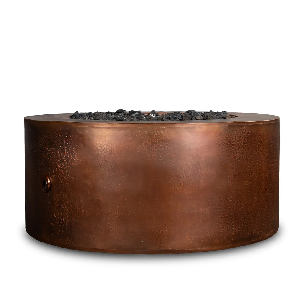 Starfire Designs Moreno 36-inch round copper fire pit, featuring a handcrafted hammered copper finish with black lava rocks, perfect for adding a touch of luxury and warmth to outdoor spaces.