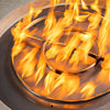 Close-up of flame ring in Starfire Designs Rustic 36-inch round concrete gravity gas fire pit in beige, highlighting efficient natural gas burning