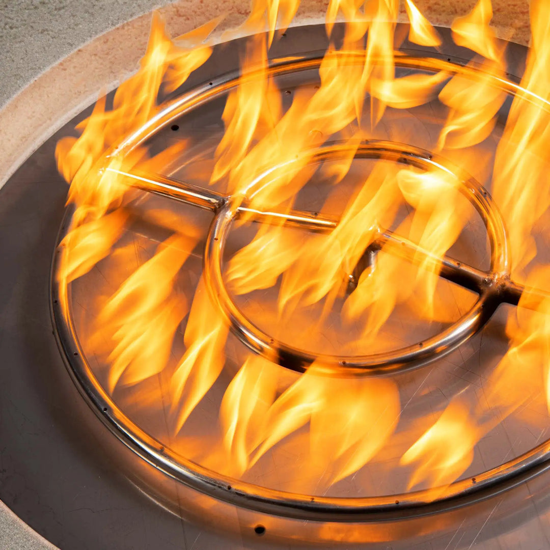 Close-up of flame ring in Starfire Designs Rustic 36-inch round concrete gravity gas fire pit in beige, highlighting efficient natural gas burning