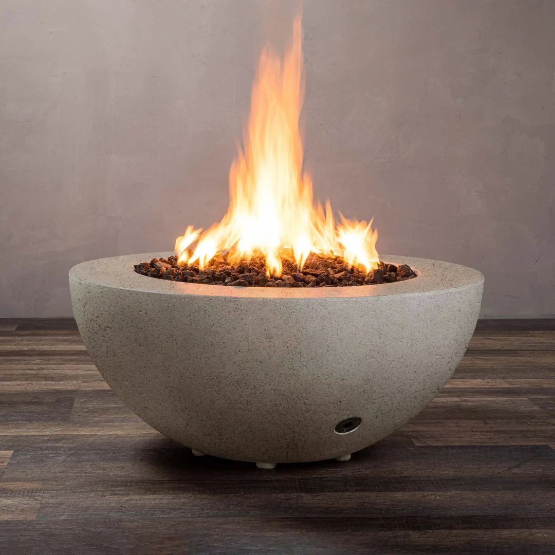 Starfire Designs Rustic 36-inch round concrete gravity gas fire pit in beige, showcasing a modern backyard fire pit with natural gas flames