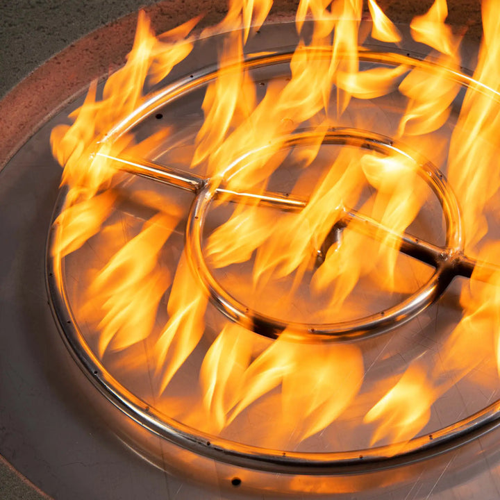 Close-up of the flame ring on the Starfire Designs Rustic 36-inch Round Concrete Gravity Gas Fire Pit in brown, demonstrating the fire pit's efficient gas burner system