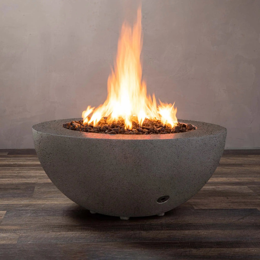 Starfire Designs Rustic 36-inch Round Concrete Gravity Gas Fire Pit in brown, showcasing a full view with a vibrant flame, perfect for modern outdoor spaces