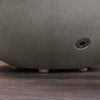 Close-up of the base and valve of the Starfire Designs Rustic 36-inch Round Concrete Gravity Gas Fire Pit in Natural Gray