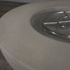 Close-up of the rim of the Starfire Designs Rustic 45-inch Round Concrete Gravity Gas Fire Pit in Beige