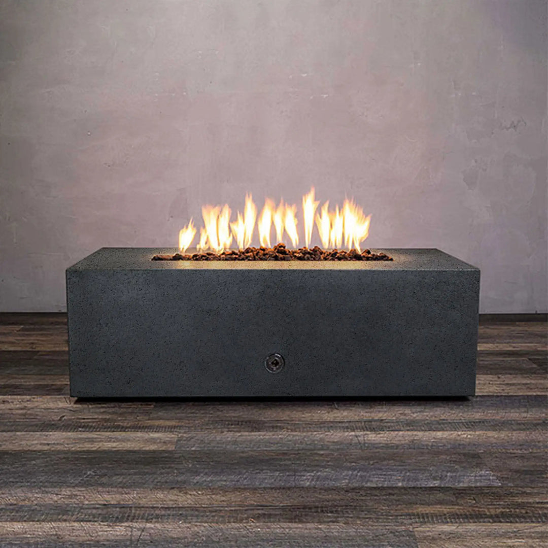 Side view of Starfire Designs Rustic 45-inch round concrete gravity gas fire pit in graphite color, lit with flames, perfect for contemporary outdoor living spaces